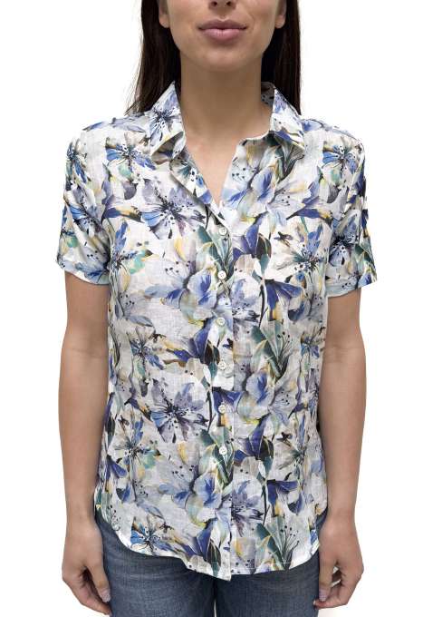 Woman wearing a floral patterned shirt on a white background