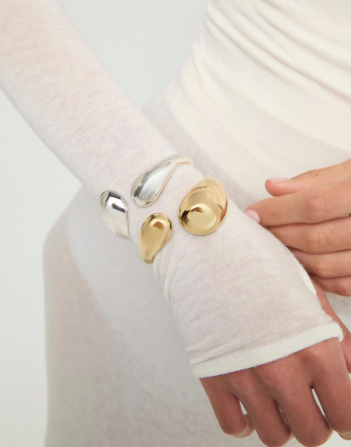 Uno de 50 Gold Bangle Bracelet with Two Irregular Drops