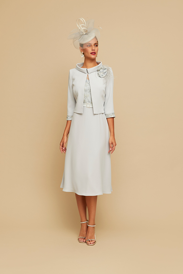 Pale blue dress and jacket for the races. Matching blue hat.